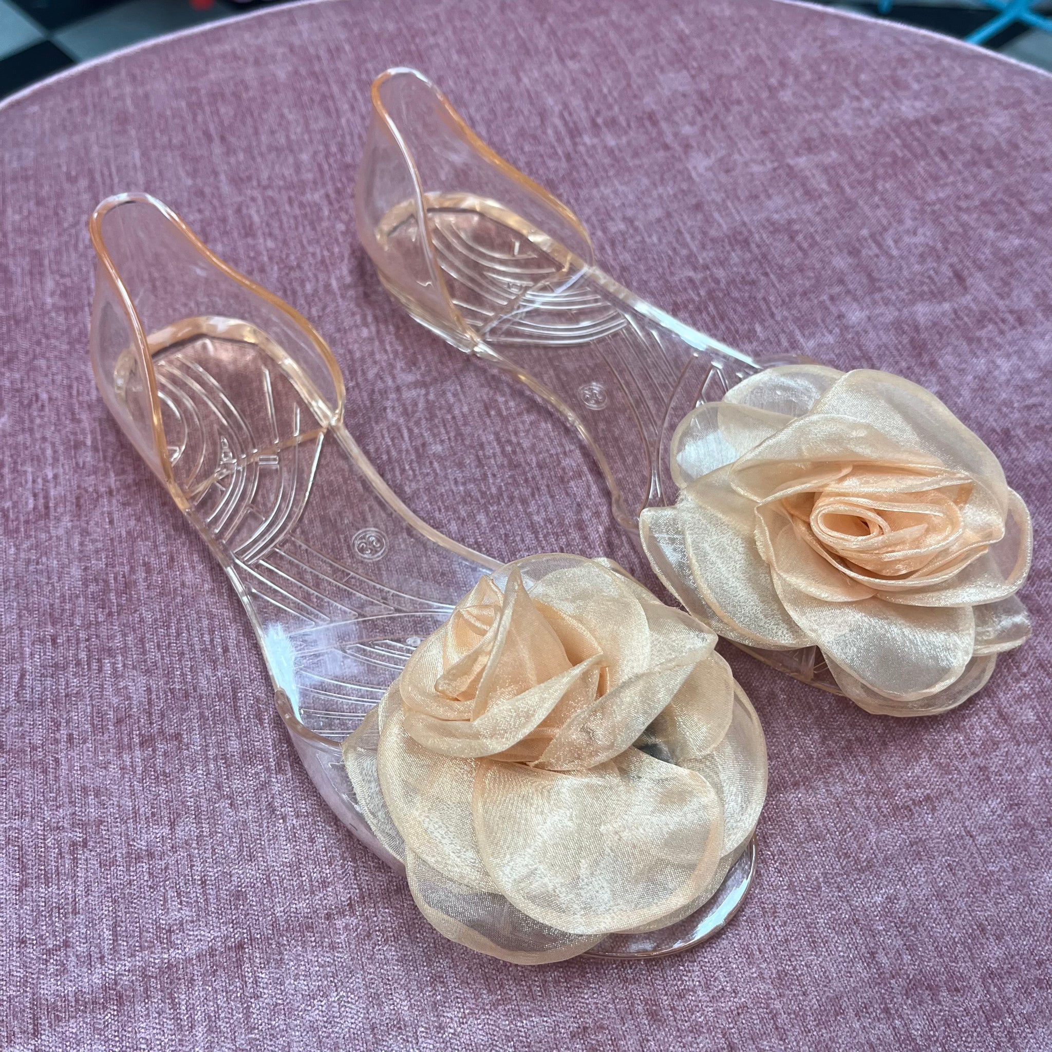 Peach Colored Transparent Flats with a Flower